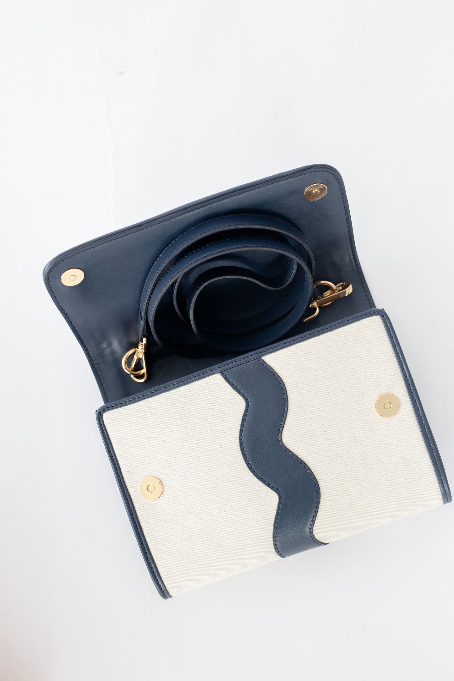 Navy blue leather Allie clutch  on a white background