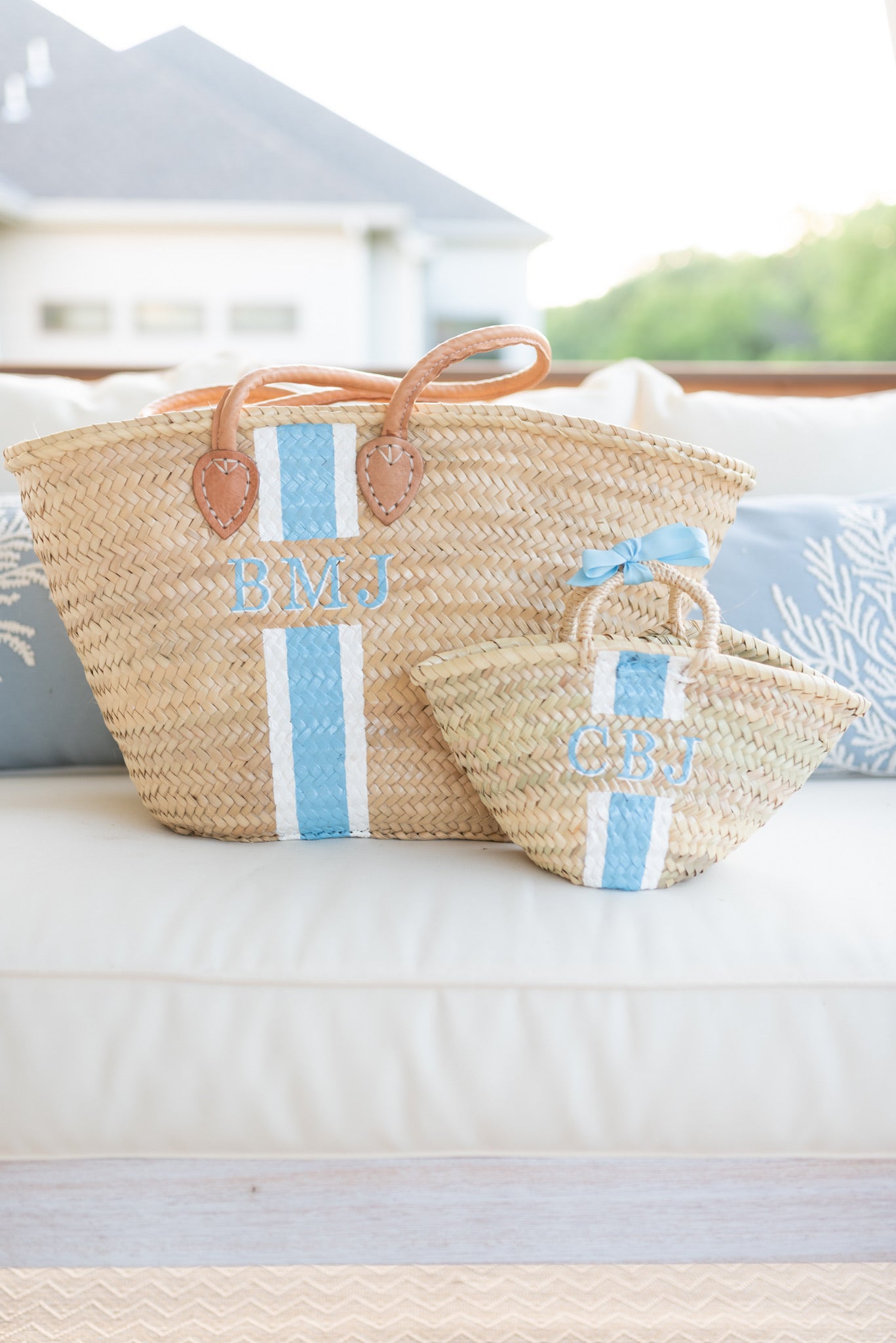 Breck & Grier Mommy and Me matching set featuring a large and mini hand-painted straw tote bag with custom french blue and white monogram stripes.