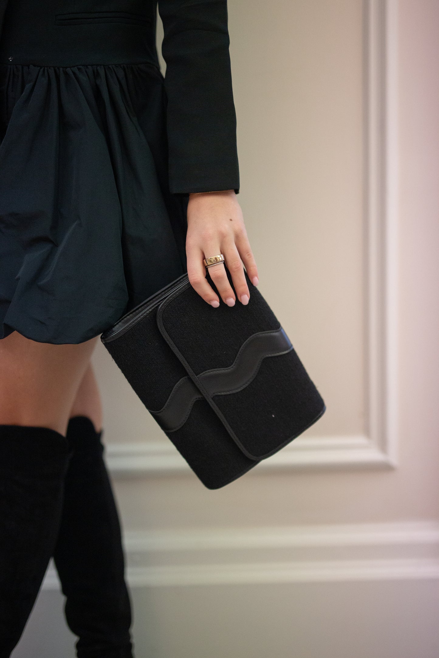 Full front view of the structured Allie tweed clutch purse showcasing the unique wavy top border details.