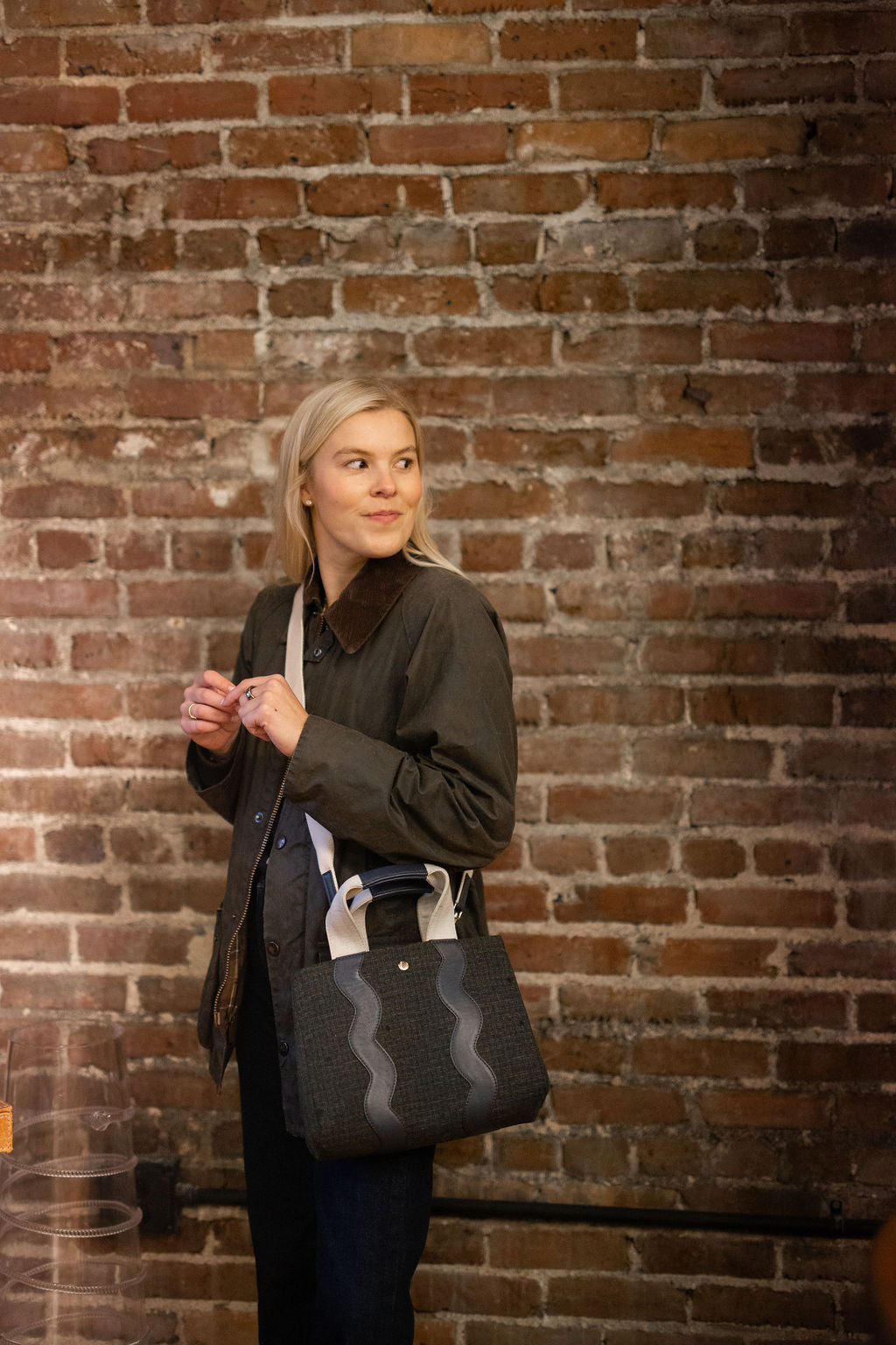 Full front view of the structured Sydney flannel tote bag showcasing its crossbody capability.