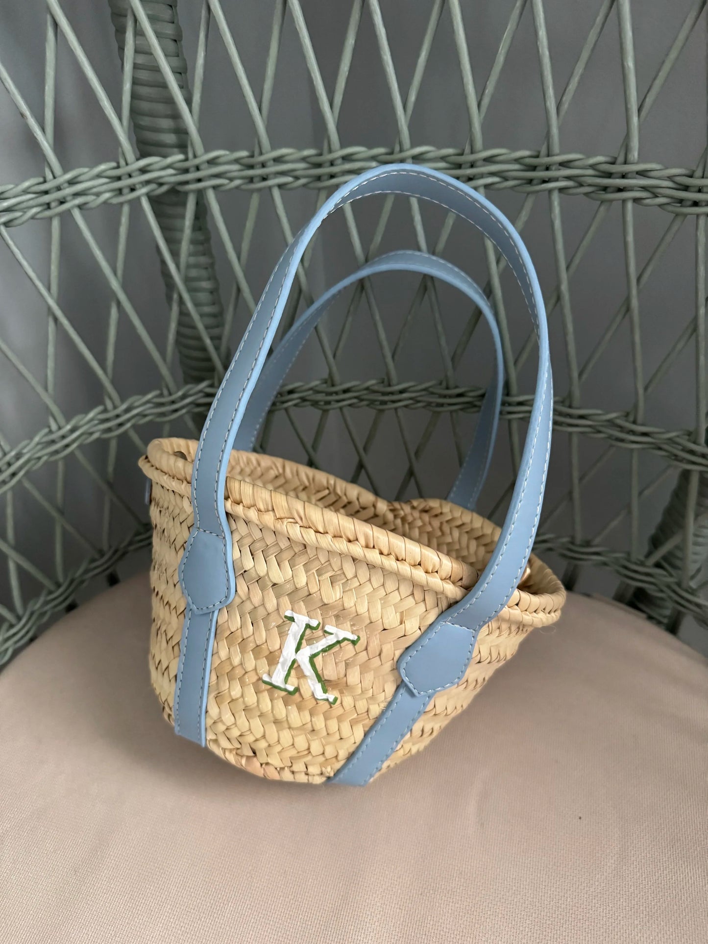 Woven basket tote with a french blue handle and letter 'K' handpainted