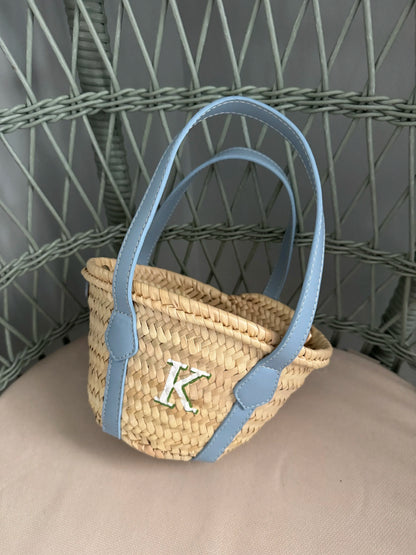 Woven basket tote with a french blue handle and letter 'K' handpainted