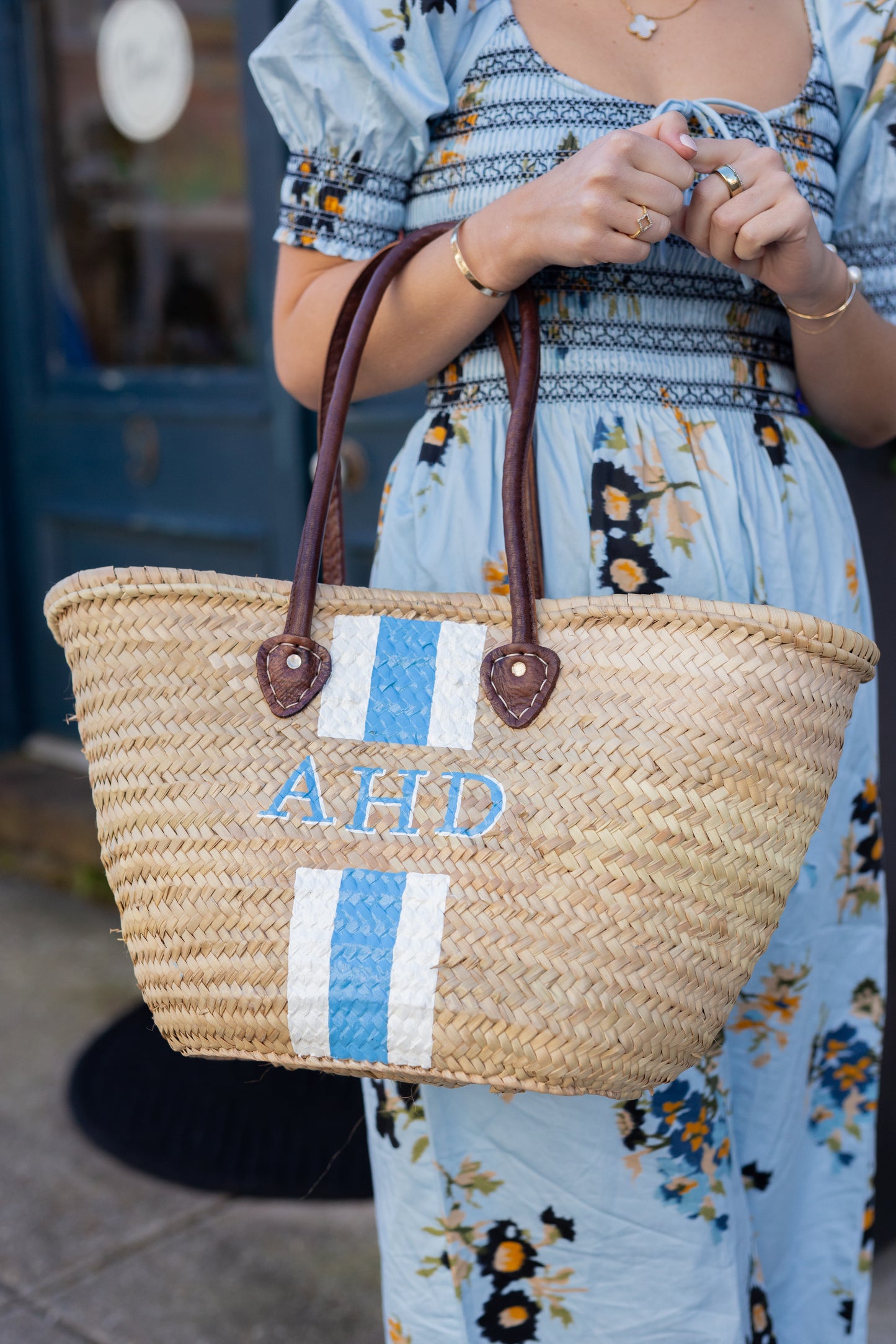 Texture detail shot of the natural Moroccan hand-woven palm leaf material on the Brecky flagship basket bag.