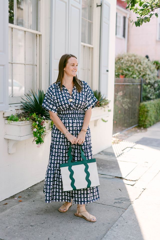 Summer vacation style featuring the Grier green leather trimmed canvas tote bag on a model.