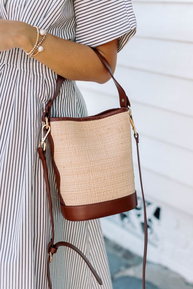 Full front view of the Boo woven rattan market tote showcasing its symmetrical handles and clean silhouette.