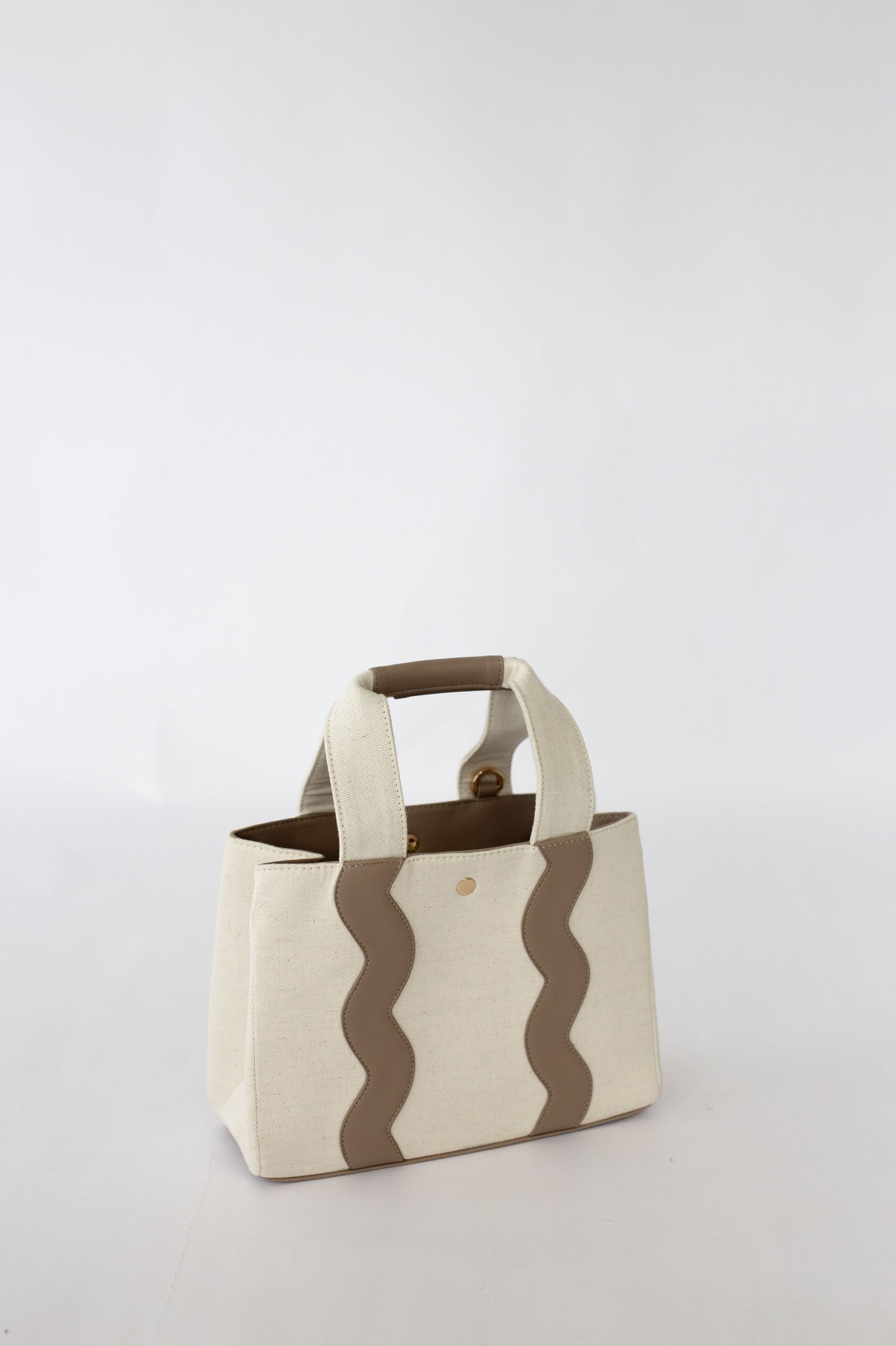 Canvas bag with scallop pattern on a white background.