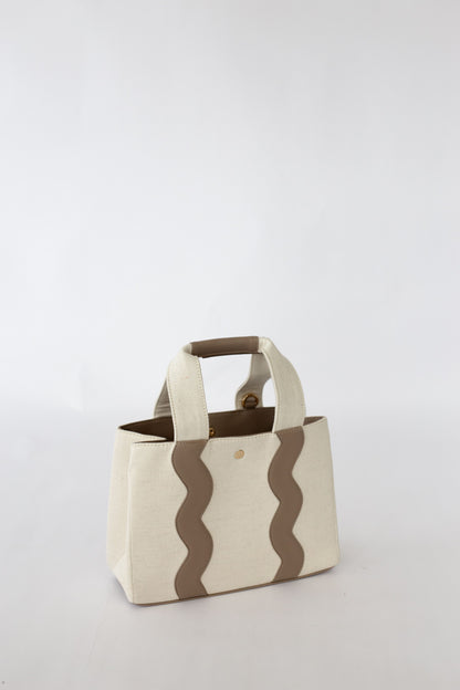 Canvas bag with scallop pattern on a white background.